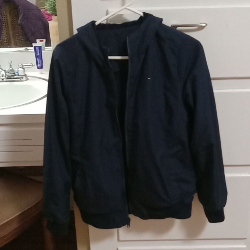 Very nice, gently used Reversible Tommy Hilfiger jacket. Navy blue. Size small.